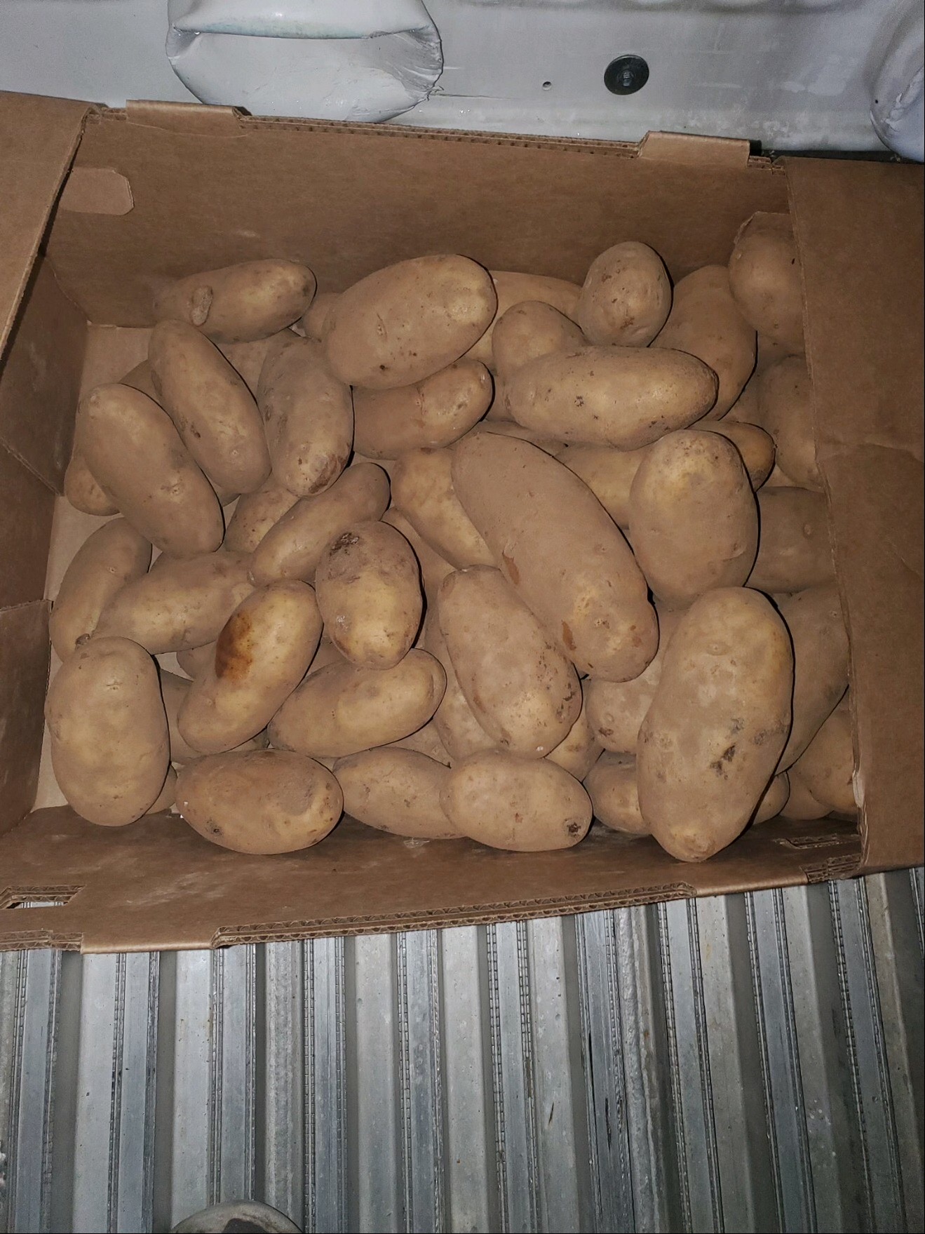 Pallet of Potatoes at front of truck